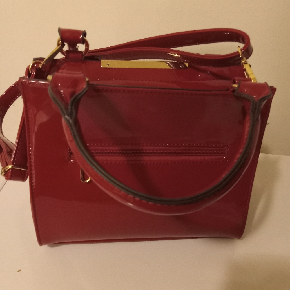Red patin leather crossbows bag. Still in good condition. - Picture 3 of 5